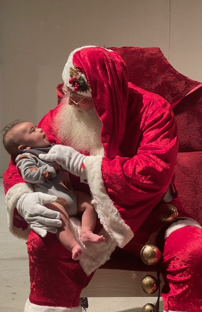 1_Santa-cuddles-one-of-the-newest-members-of-the-community