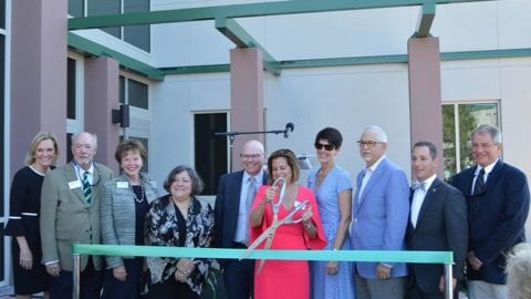 Community Counseling Center Director Alise Bartley cuts the ribbon