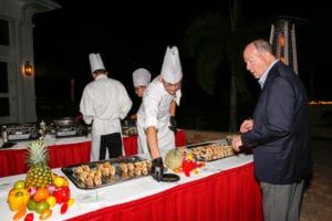 Bob Lienesch interacts with culinary student Silas Sutton at Evening Under the Shadow Wood