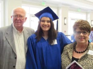 New Horizons graduate Yariria Angeles with volunteers John and Jeanne Rowe at the annual luncheon