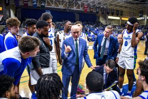 Mens Coach Pat Chambers Calls a Huddle- by Adam Koszo