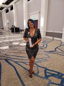 Kell Thawley with her 40 Under 40 Award in 2022