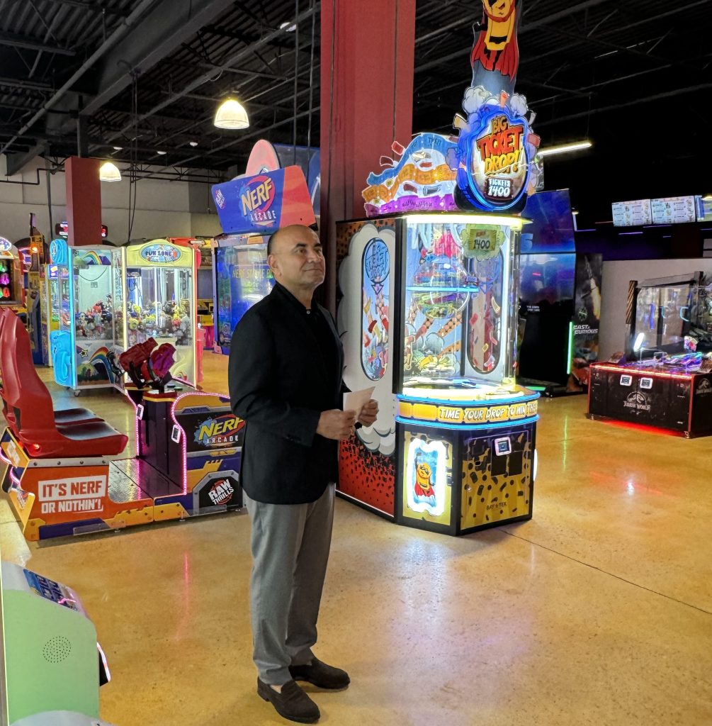 Owner Tony Sandhu speaks during the grand opening of 810 Billiards and Bowling