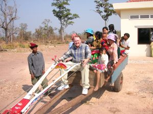 Nolen Rollins delivering Operation Christmas Child gift boxes from Samaritan's Purse in Cambodia