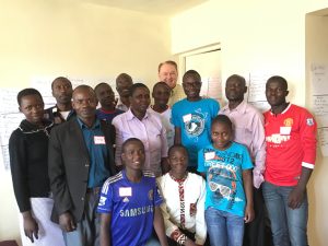 Rollins tutoring orphan teenagers at an orphanage he founded in Kenya