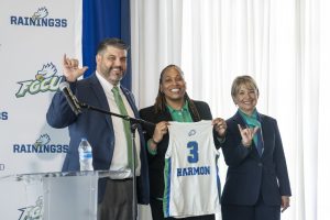 Athletic Director, Colin Hargis and FGCU President Aysegul Timur with Coach Harmon