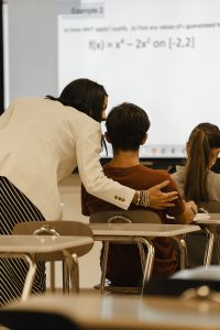Principal Seluk checks in on a student